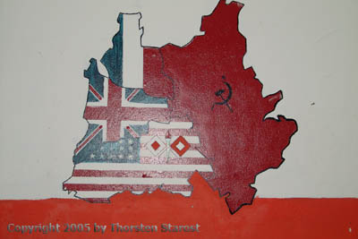 Image of a Wall Painting showing the Signal Corps' Branch Insignia on a berlin Map.